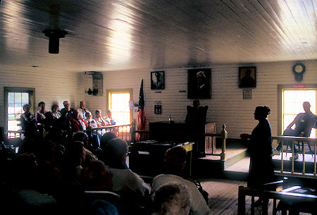 Courtroom (with tour group), Judge Wikersham Courthouse and Museum, Eagle, Alaska