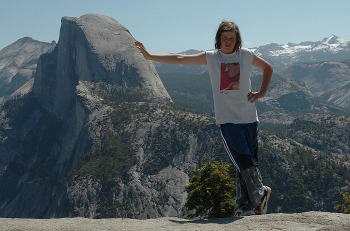 Andrew leaning against Half Dome