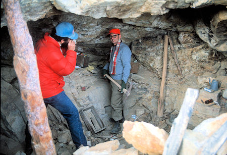 Mike Cassiday photographs Joe Cremi with pick at entrance to one of the tunnels at Pat Keyes Mine