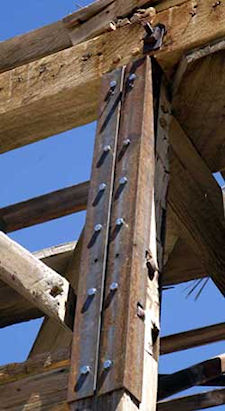 Angle iron brackets bolt together a supporting beam. Original wooden pegs can be seen at the top of the bracket. (Explore Historic California Collection)