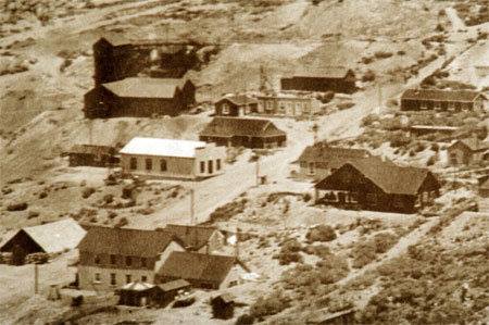 Cerro Gordo about 1916; at top just right of center is Lola's dance hall with the girl's cribs below next to the Assay Office. The large building to the left below the tram station and the building below the Assay Office are both gone. Next, to the left, the white building is Belshaw's Store, then the Belshaw House partly behind the Gordon House. Bottom left is the Mule Barn, then the American Hotel with the cooler room and ice house in front and the Crapo House behind (Friends of Cerro Gordo Collection)