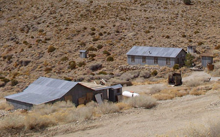 Back of Reddy's Garage before conversion to church (left), Bunk House (right) 2002