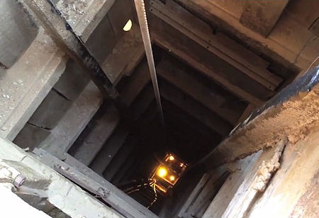 Looking down the Belshaw Shaft at the cage  in Union Mine Hoist House 2013