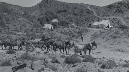 Mule driven wagons carrying water to a construction site for the Leschen tram (Friends of Cerro Gordo Collection)