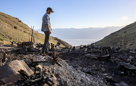 Brent Underwood looking over the American Hotel fire ruins Brent Underwood looking over the American Hotel fire ruins