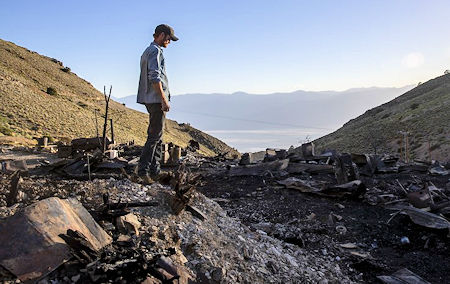 Brent Underwood looking over the American Hotel fire ruins