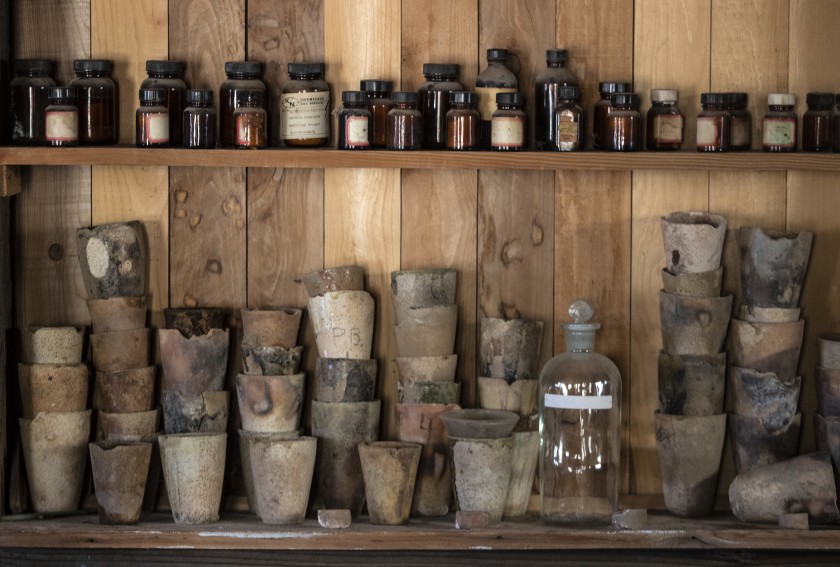 Vintage chemical jars and crucibles on a shelf at the Cerro Gordo ghost town in the Inyo Mountains Vintage chemical jars and crucibles on a shelf at the Cerro Gordo ghost town in the Inyo Mountains