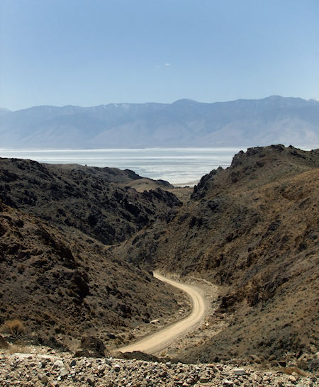 The view from high up the 8-mile Yellow Grade Road, looking back toward Owens Lake below and the eastern Sierra in the distance. The yellowish hues of the shale, from which the road derives its name, are starting to show themselves