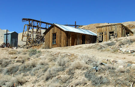 At center is the assay office. Behind it to the left is the tramway structure at the Union Mine. At far left is a modern outhouse. At right is one of the cribs from Lola's brothel.
