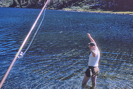 Bob Brooks retrieving hung up fishing line in Fourth Recess Lake - John Muir Wilderness 12 Aug 1962 Bob Brooks retrieving hung up fishing line in Fourth Recess Lake - John Muir Wilderness 12 Aug 1962