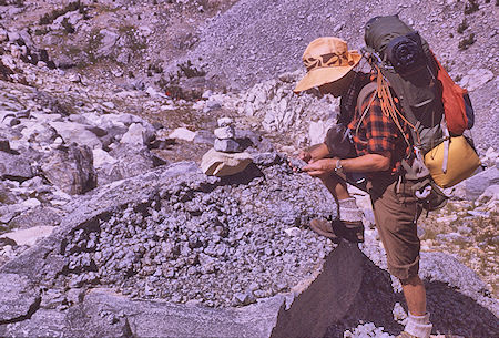 Gil Beilke examining decomposing granite<br>Kings Canyon National Park 30 Aug 1970 Gil Beilke examining decomposing granite<br>Kings Canyon National Park 30 Aug 1970
