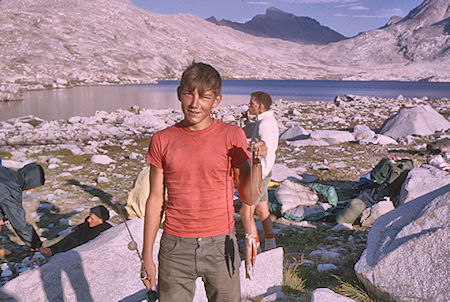 Fish catch at camp at Wanda Lake, Muir Pass beyond lake<br>Kings Canyon National Park 25 Aug 1964