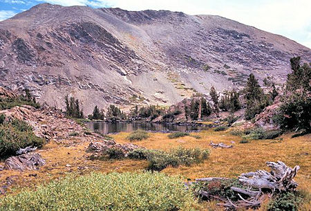 Shortly before arriving at Upper Sardine Lake the trail passes this pond. The high point on the left is at or near the top of Mt. Lewis Shortly before arriving at Upper Sardine Lake the trail passes this pond. The high point on the left is at or near the top of Mt. Lewis