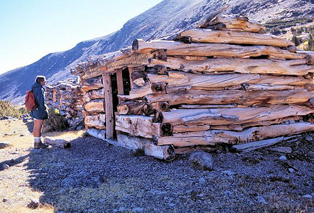 Kevin Twohey checks out mine cabins circa 1890's at Mono Pass Kevin Twohey checks out mine cabins circa 1890's at Mono Pass