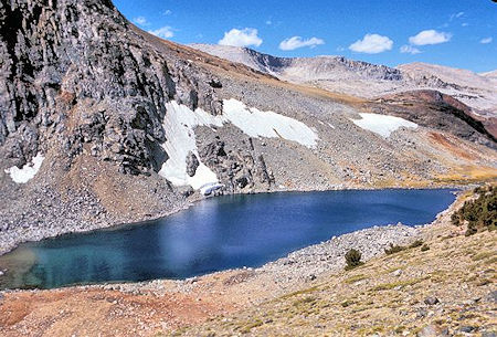 A short distance southwest of Parker Pass is Parker Pass Lake. Helen Lake is located behind the foreground ridge with the snow patches A short distance southwest of Parker Pass is Parker Pass Lake. Helen Lake is located behind the foreground ridge with the snow patches