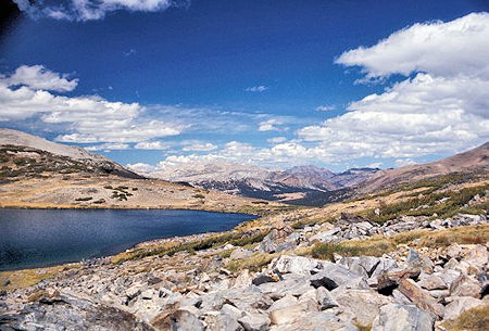 View from Helen Lake down the Dana Fork shows the Dana Meadows. Tioga Pass is just beyond the right end of the meadows View from Helen Lake down the Dana Fork shows the Dana Meadows. Tioga Pass is just beyond the right end of the meadows