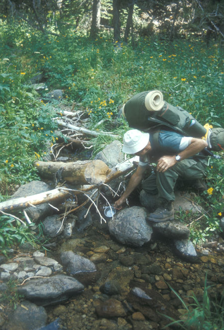 Gordon Lee getting water from Buck Creek - Yosemite National Park - Aug 1973