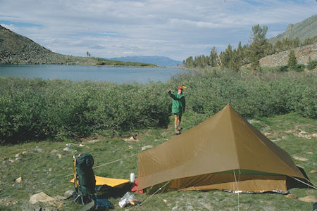 Throwing a Frisbee at camp at Hunewill Lake - Hoover Wilderness 1980