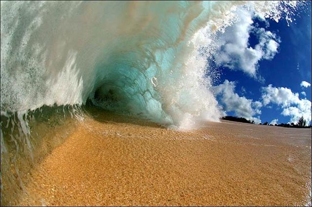 Beach - surf crashes down - Clark Little/SWNS