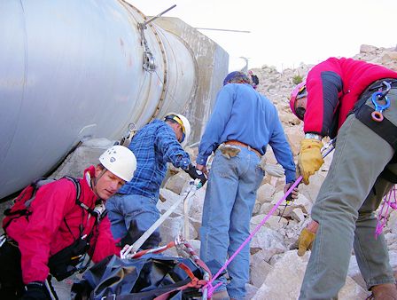 Team members and DWP personnel perform a low-angle raising in the Owens Gorge