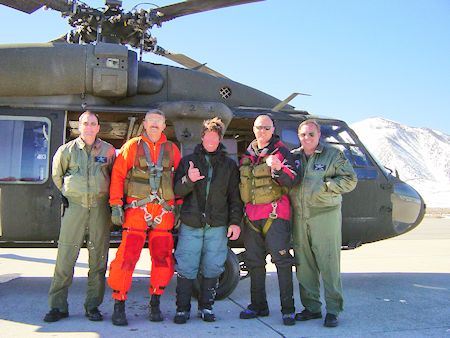 Helicopter crew and subject (center)