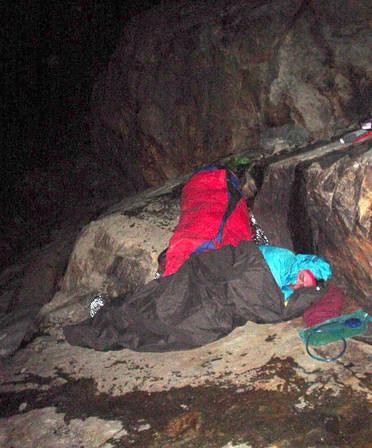 The ledge was wet and small and sloping towards the glacier. Doug is in my bag and Marcos is in my bivy sack. I'm up stamping my feet all night