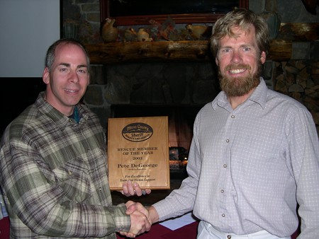 Pete DeGeorge receiving Pete Schoener Rescue Member of the Year from President Greg Enright