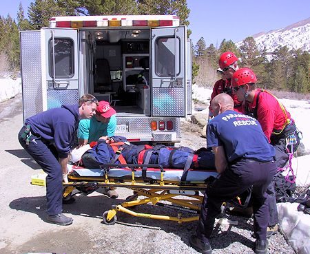Loading victim in ambulance - JW Photo