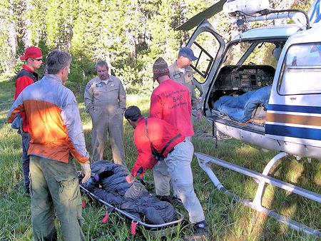 Somoano moved by litter to helicopter landing zone
