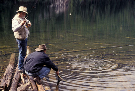 Whidbey Island print shop owner and Radio Shack owner hook a trout at Black Lake, Pasayten Wilderness, north of Winthrop, Washington
